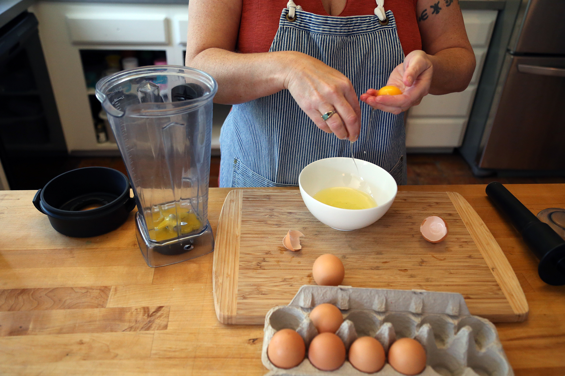 Separate the egg yolks and add them to the blender to make the Hollandaise.