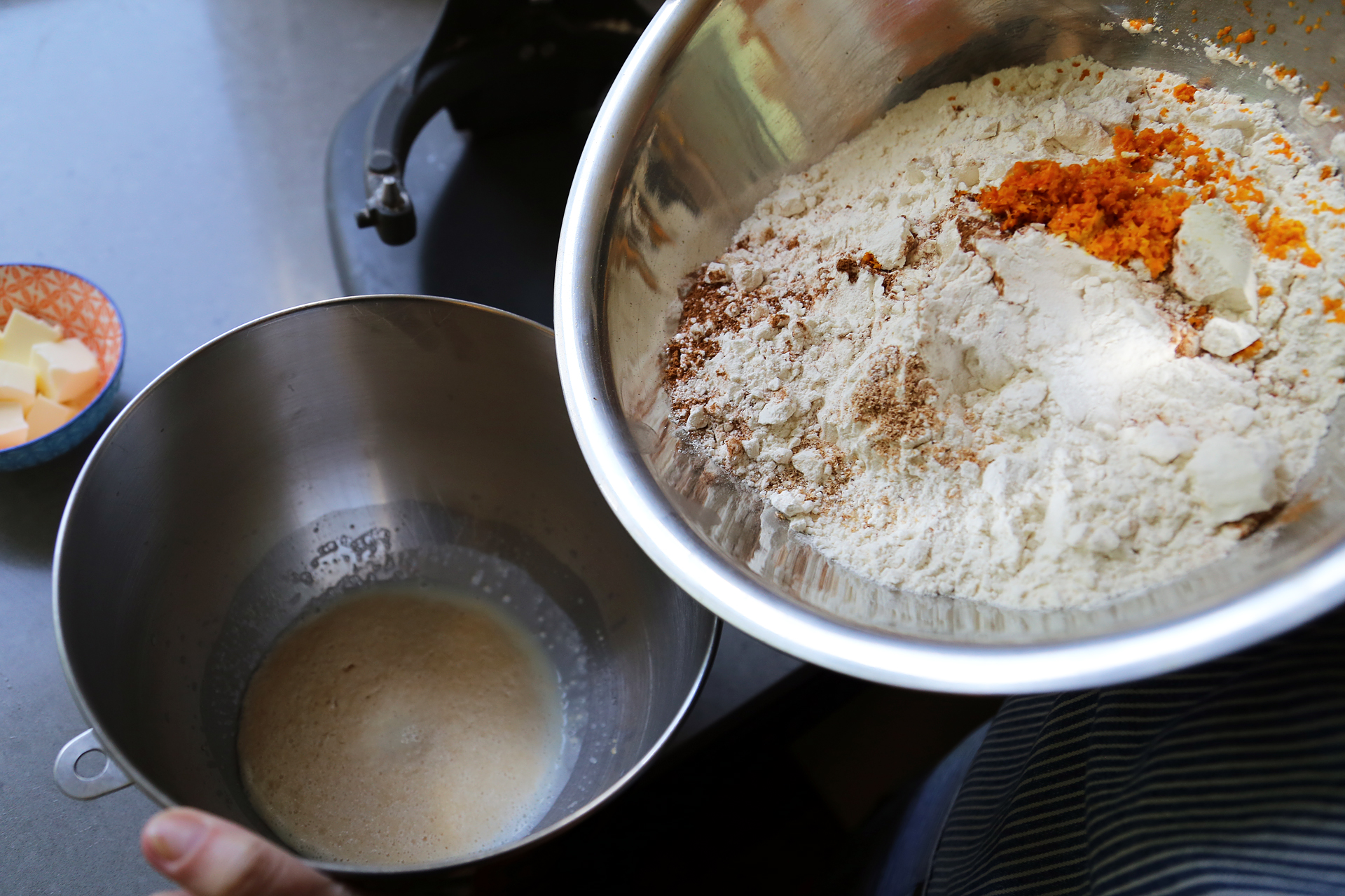 Dissolve the yeast and granulated sugar in the warm milk and let stand until foamy, about 10 minutes. Add the eggs, flour, orange zest, spices, and salt.