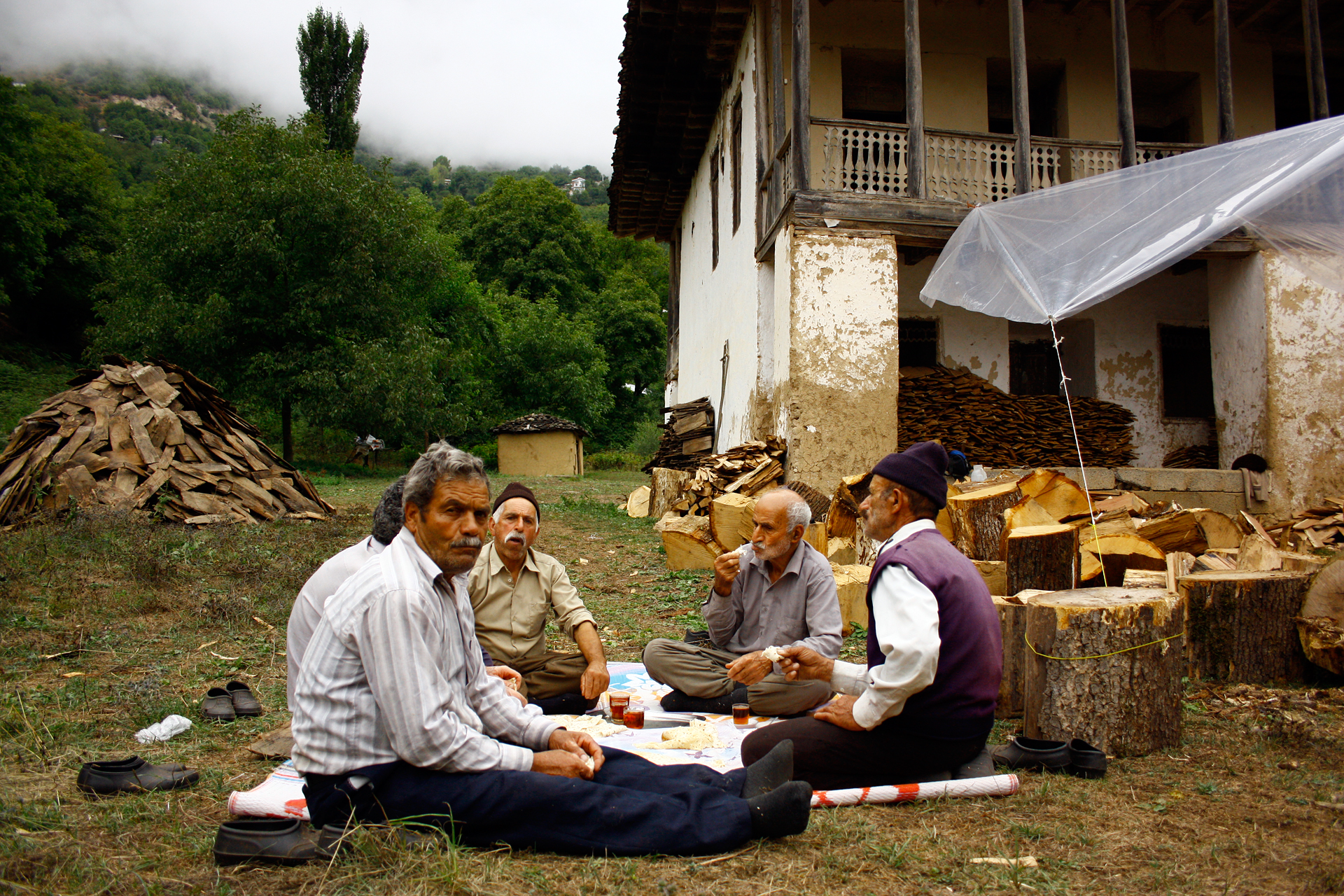 Local carpenters in Gilan, Iran drink tea in the afternoon. They made 15,000 wooden sheets of oak wood to repair the old house roof of his grandparent’s farmhouse.
