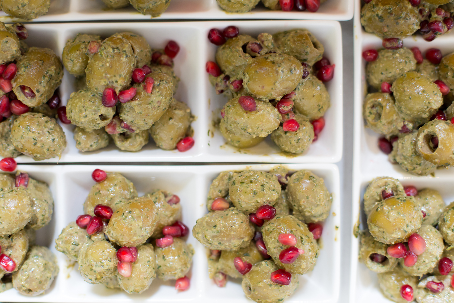 Zeitun Parvardeh are green olives marinated with pomegranate molasses, walnuts and a blend of of herbs.