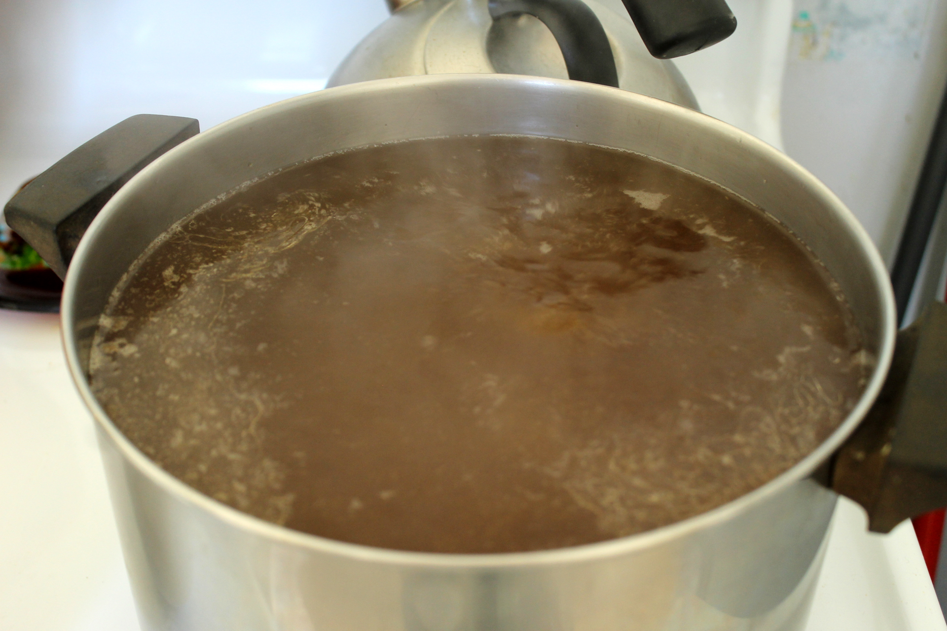 Reducing the strained broth further concentrates flavor and nutritional goodies.