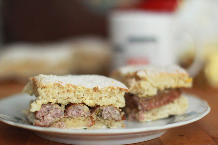 Fillings like this sausage are typically added after the blaa is taken out of the oven — as soon as possible!