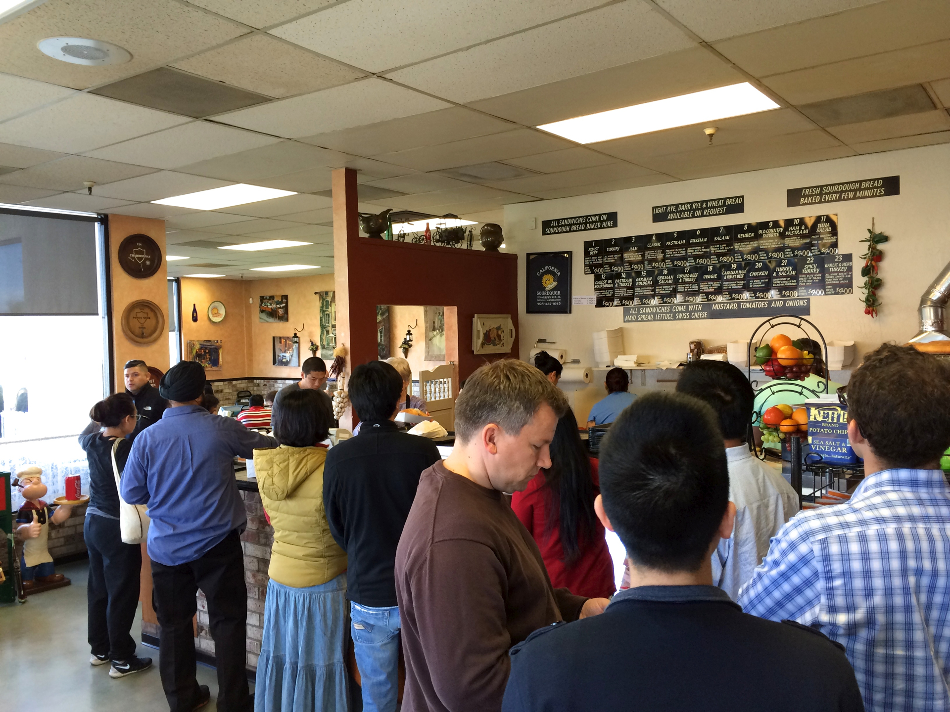Customers wait to order at California Sourdough in San Jose.
