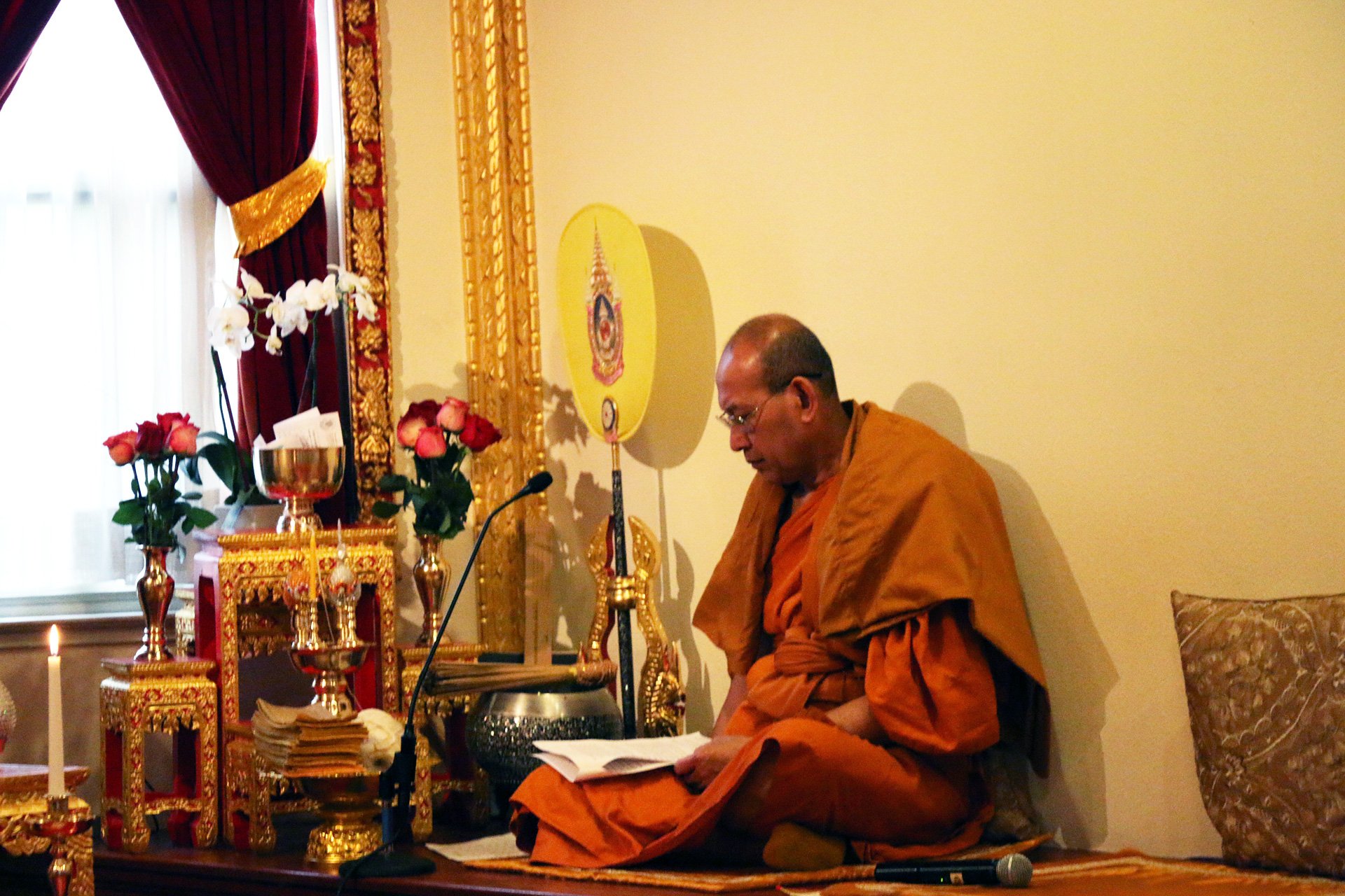 A monk preparing to welcome congregants to the Songkran festival.