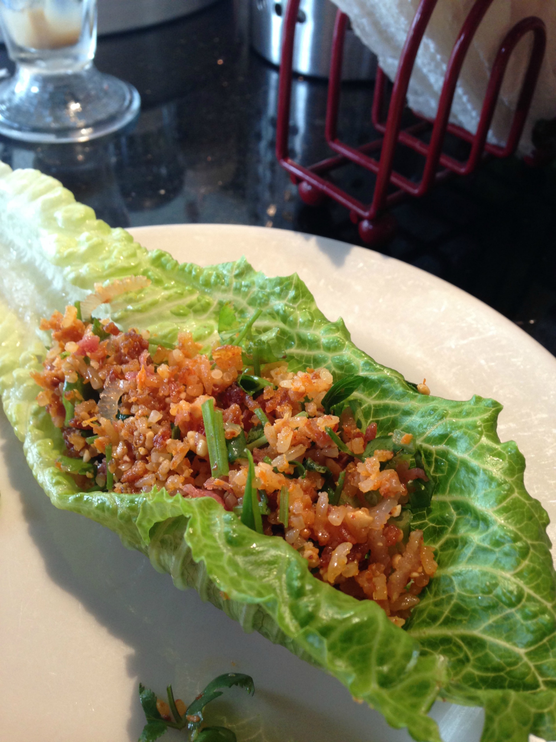 A lettuce wrap with the fried rice ball salad.