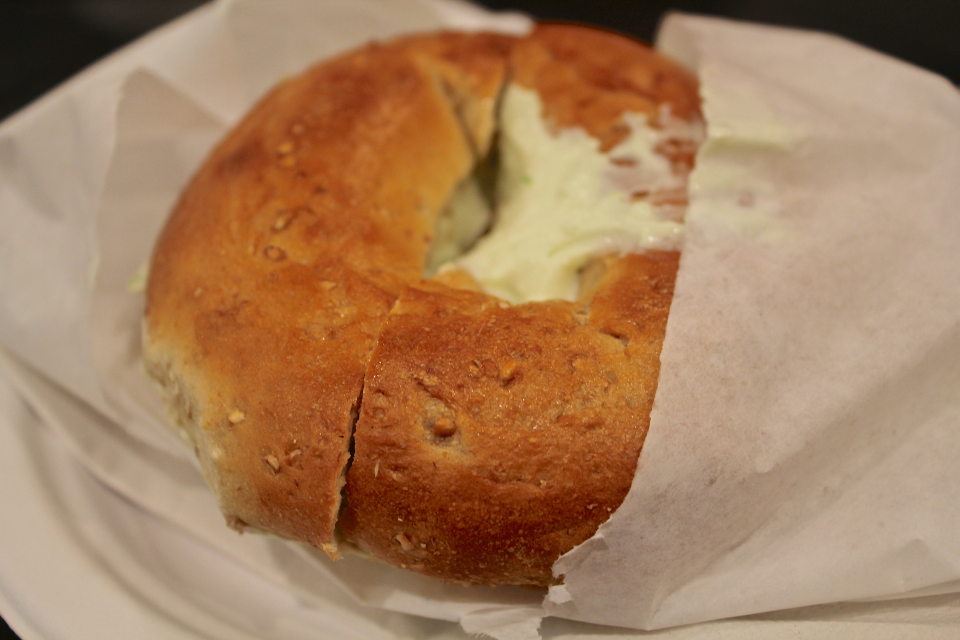 A whole wheat bagel with plain cream cheese at Izzy’s Brooklyn Bagels.
