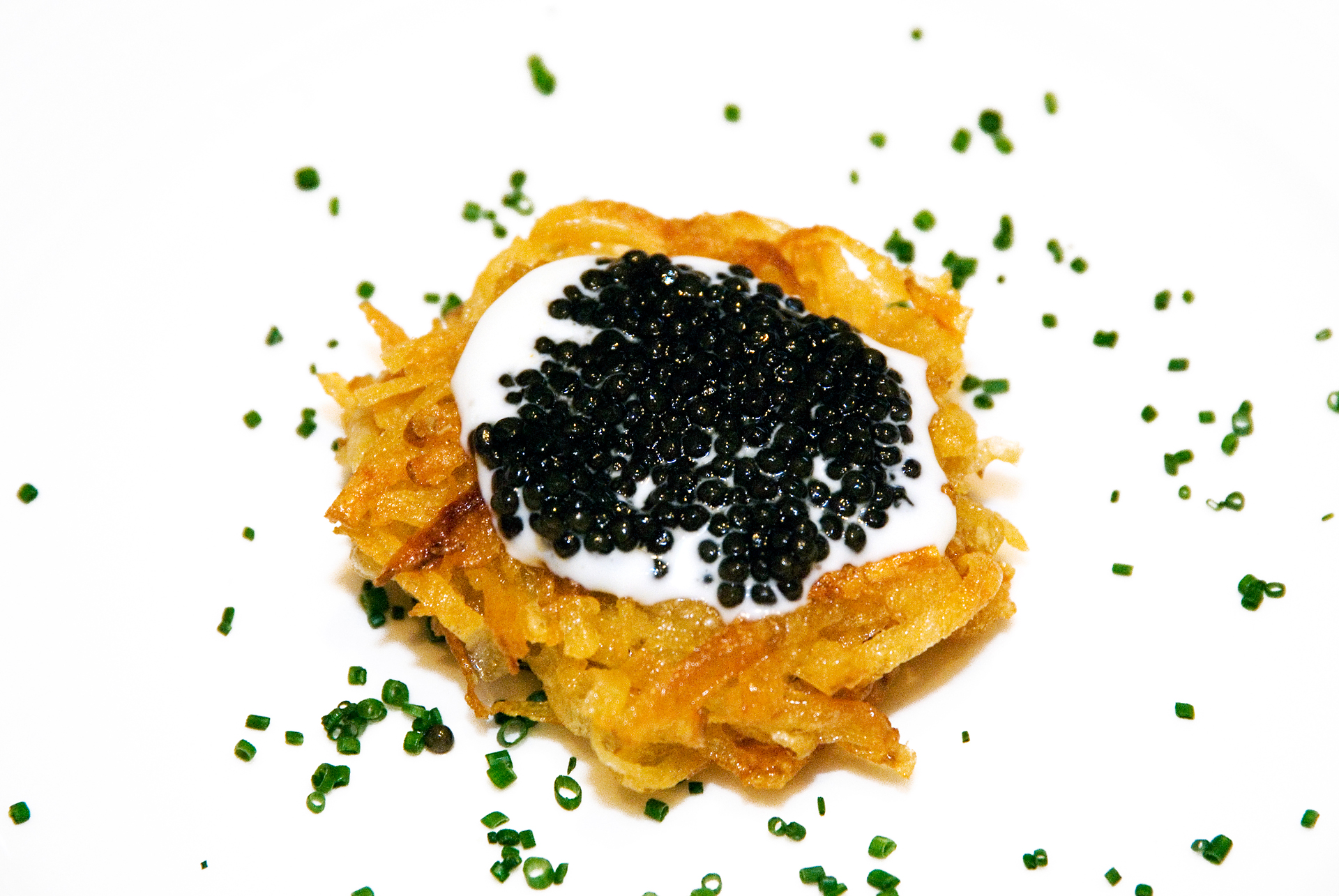Crisp Rosti Potato with creme fraiche and caviar.