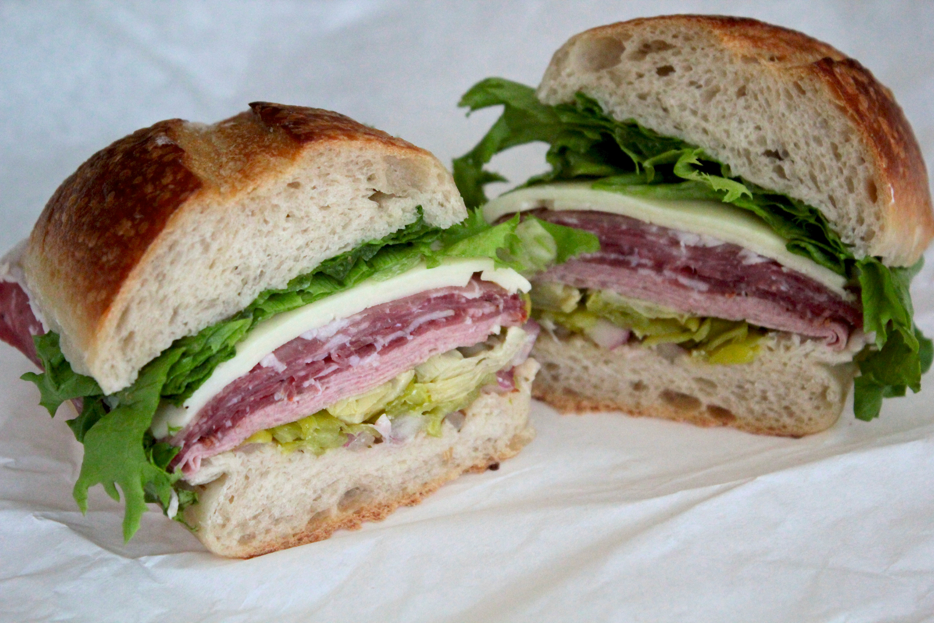 The Godfather sandwich features salami, coppa, prosciutto, mortadella, artichoke hearts and pepperoncinis.
