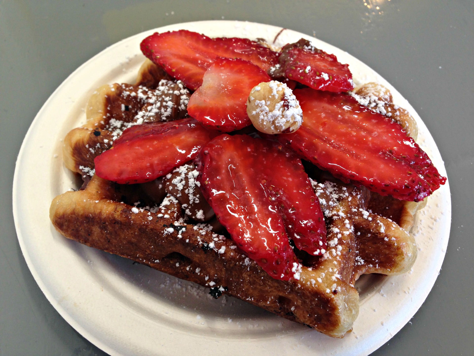 A Nutella and strawberry topped liege waffle at at Little Gem Belgian Waffles.