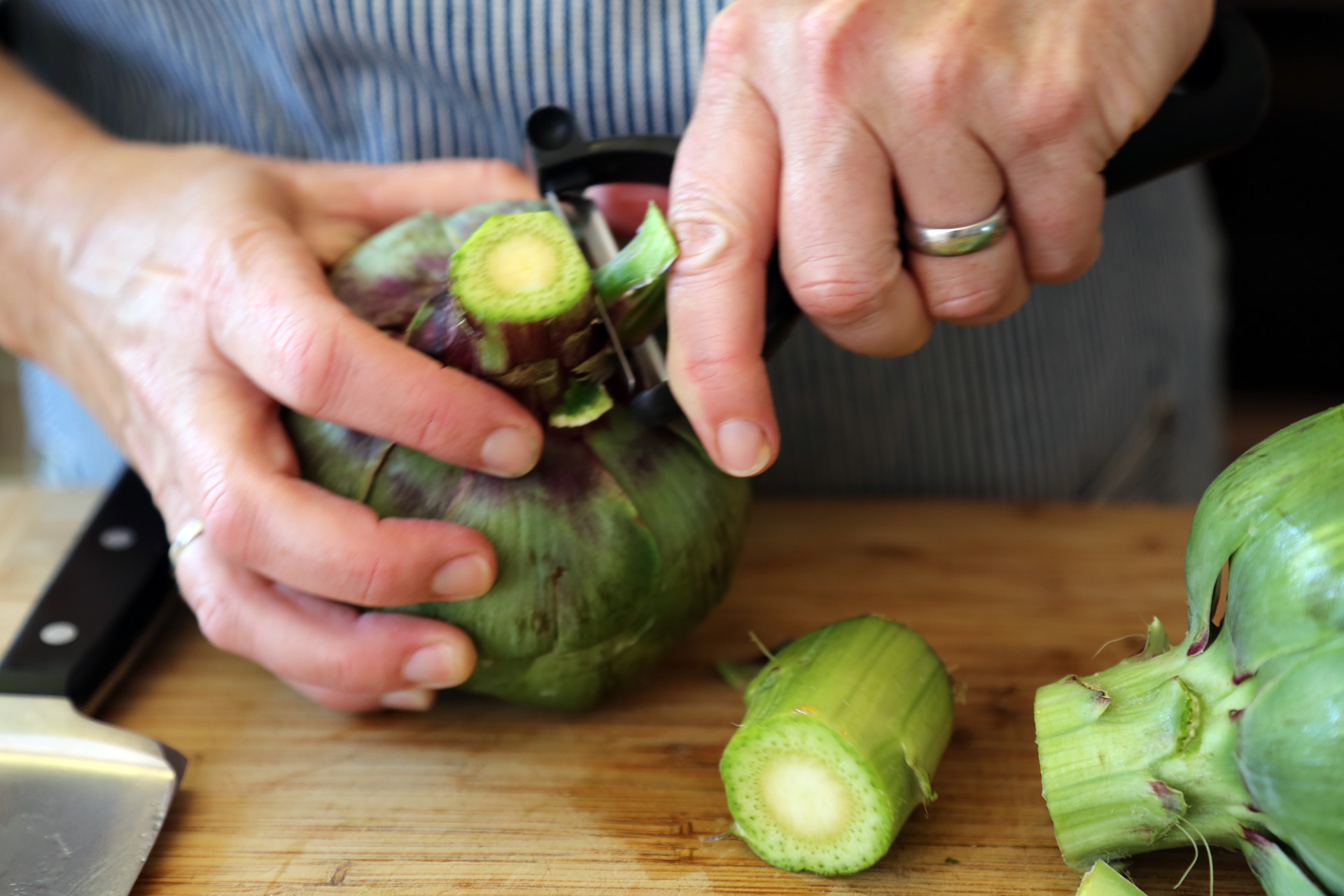 Using a paring knife or peeler, trim the stem and peel away the tough outer fibers.