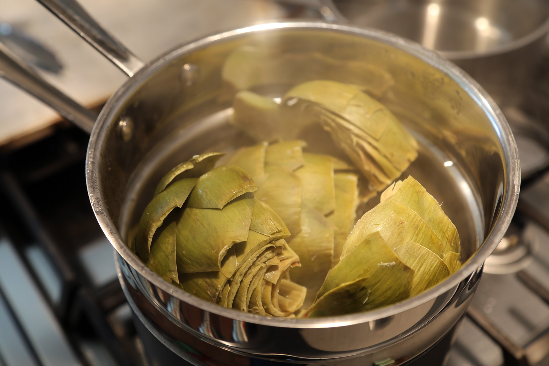 Cover and steam until the heart of the artichoke and the stem is tender when pierced with a paring knife, about 20 minutes. 