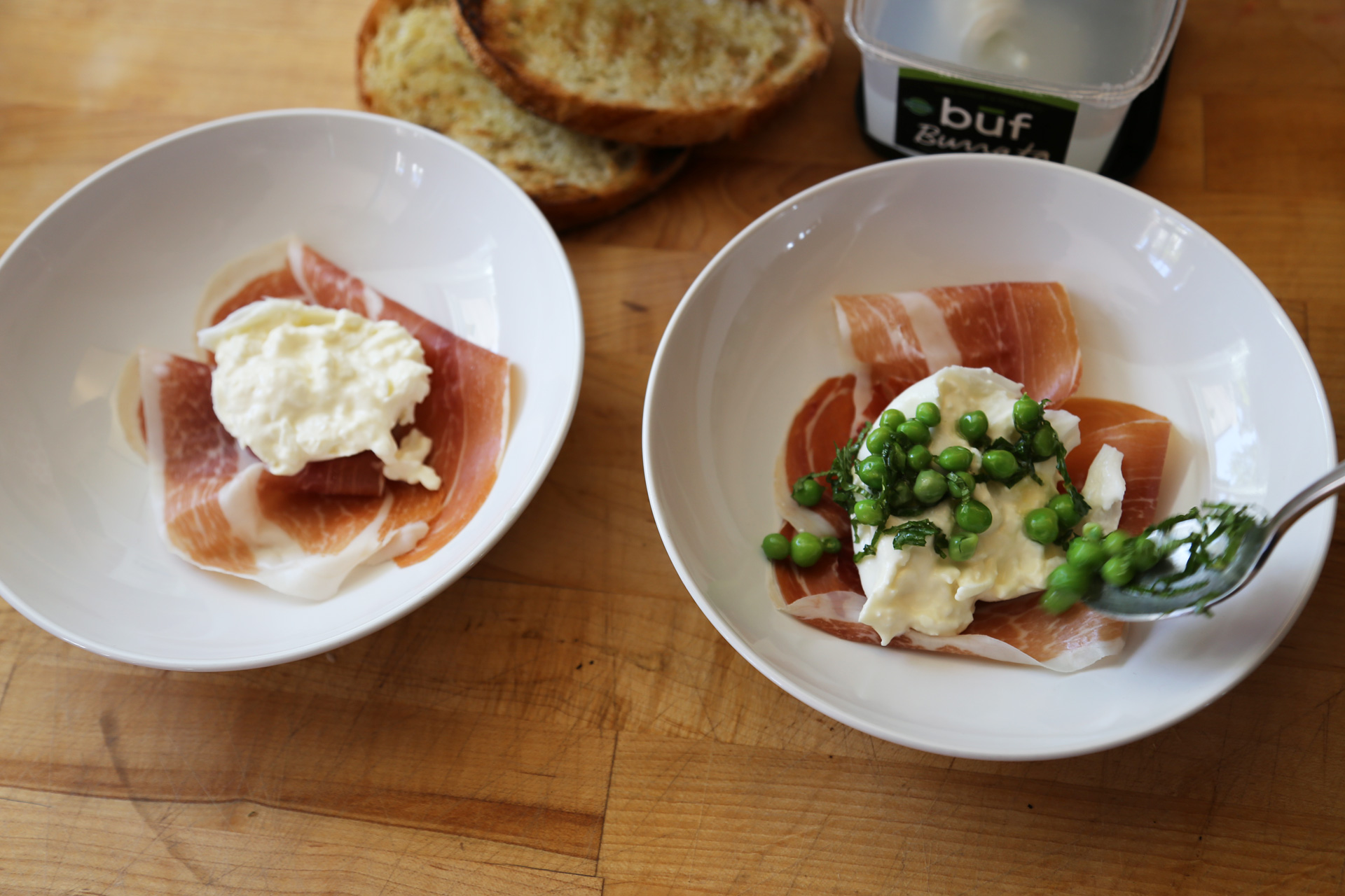 Top with a chunk of burrata. Spoon the pea mixture over the burrata, dividing it evenly.