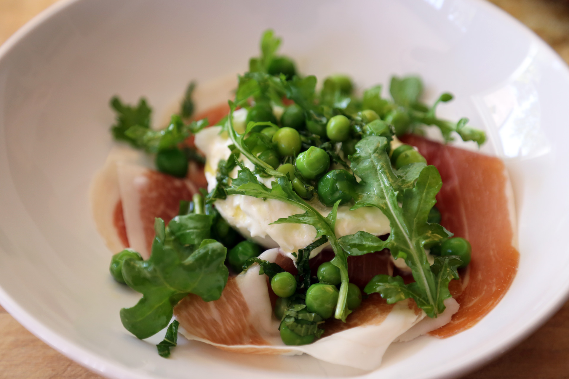 Top with a little arugula and serve.