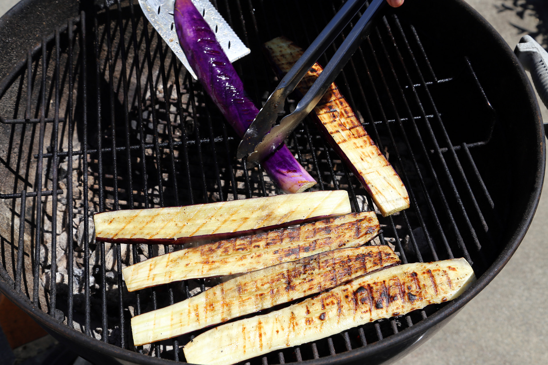 Place the eggplant slices over the heat in a single layer and grill, turning once, until tender and there are dark grill marks.