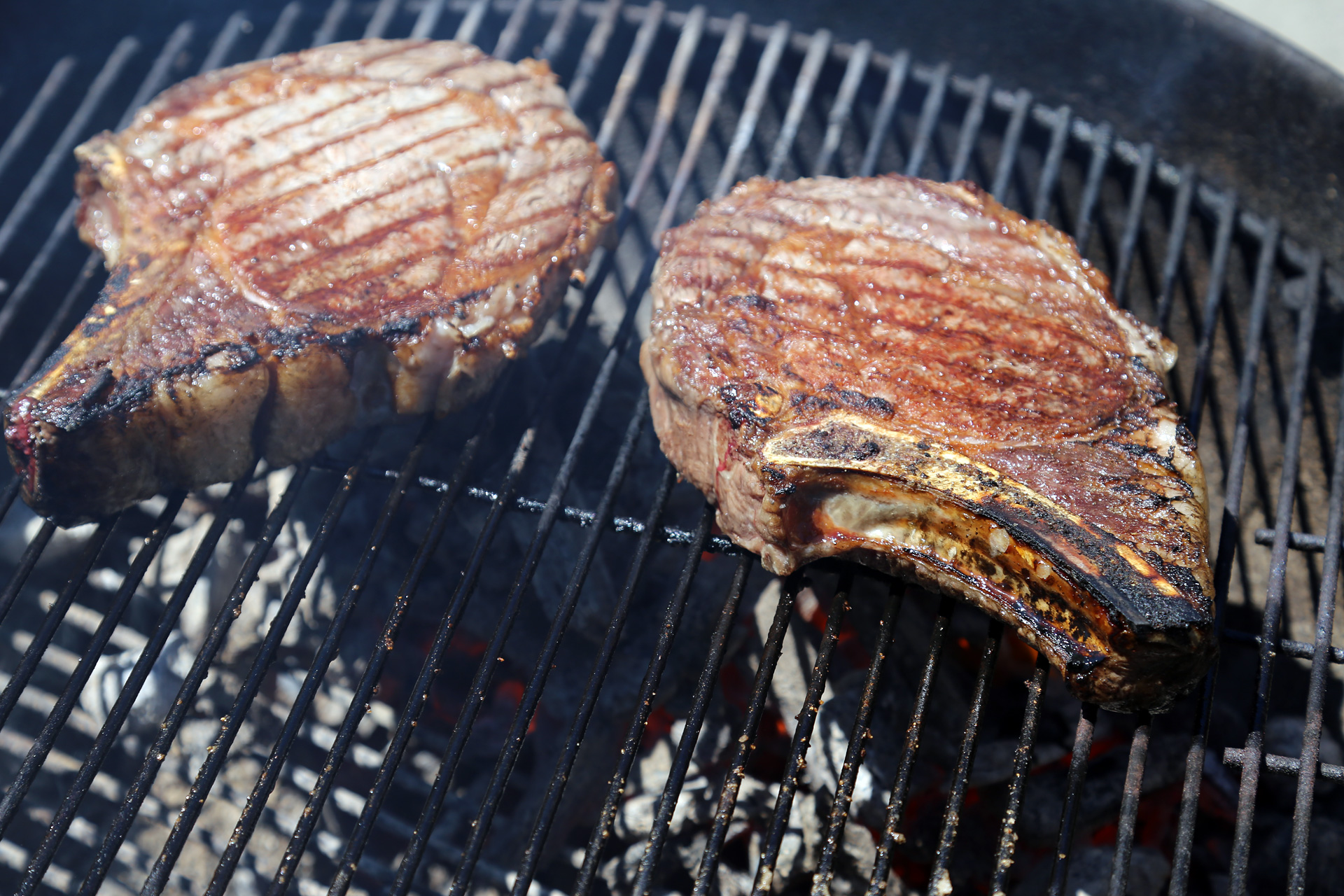 Sear the steak over the hot fire until a nice char forms on the exterior, turning occasionally.