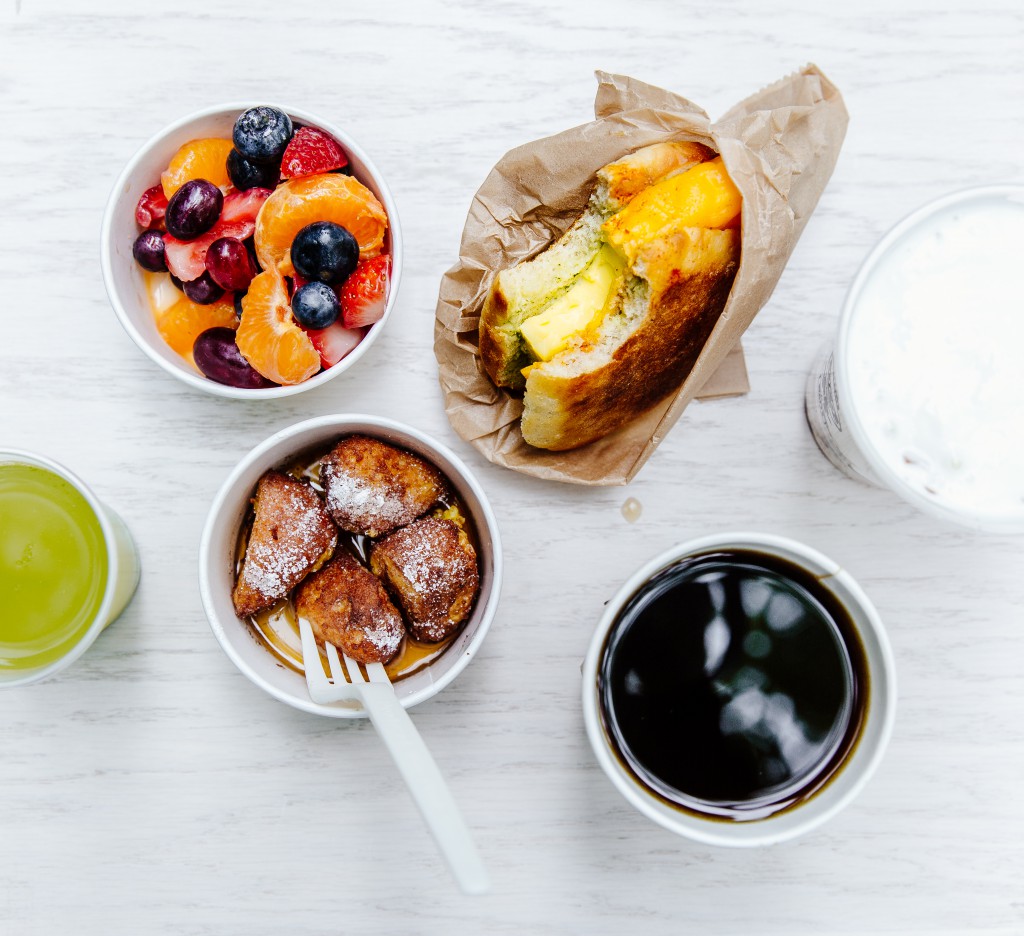 Brekkie Egg in the Hole, French Toast Holes, Yogurt and Granola, Fresh Fruit, Coffee, and Green Juice.
