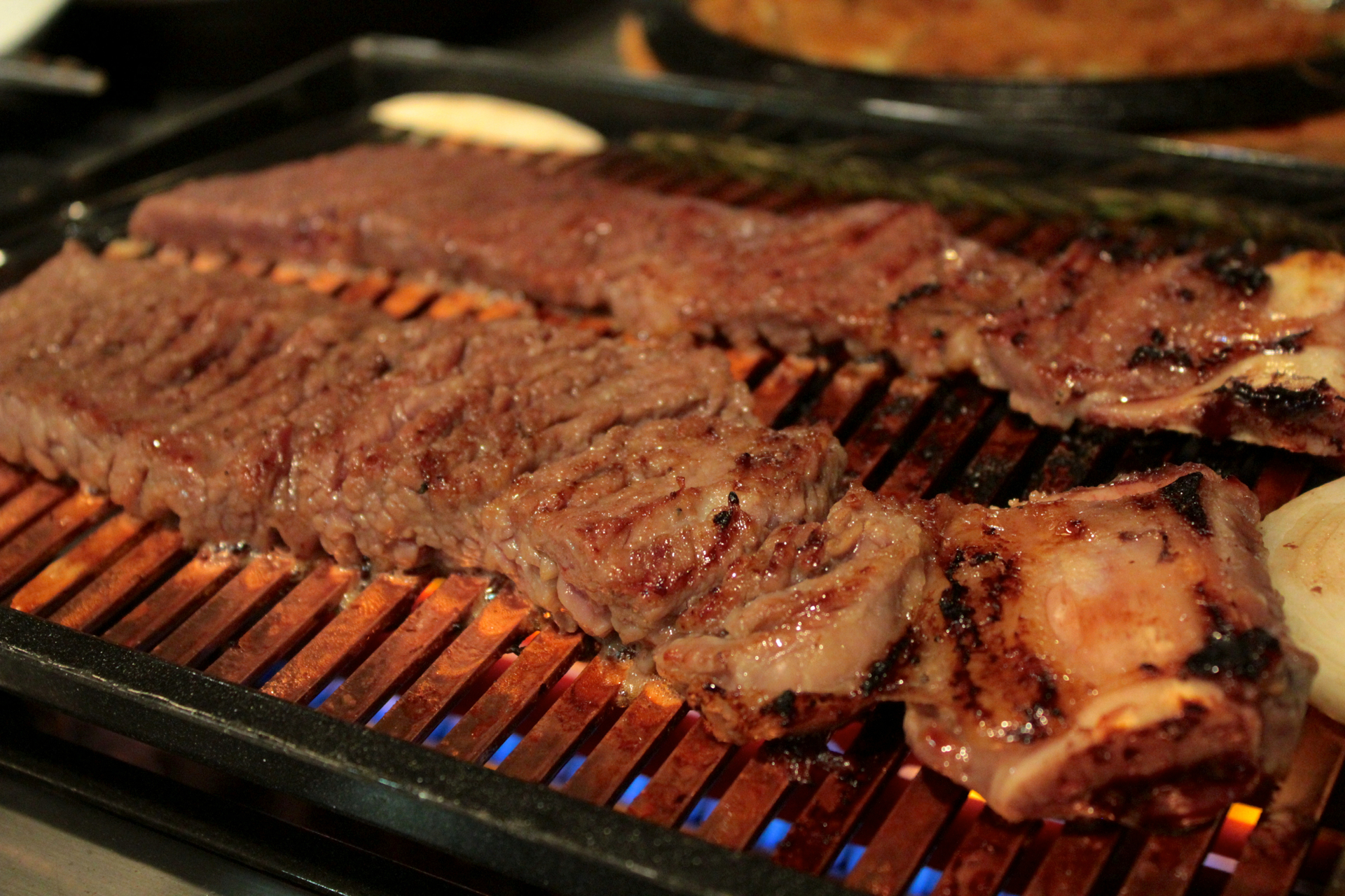 Marinated beef short rib on on the grill at Chungdam.