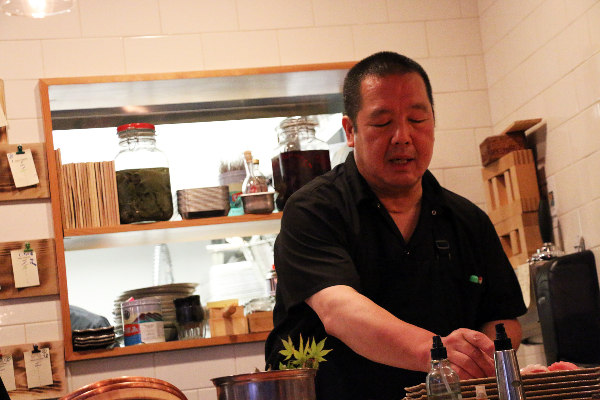 Chef Masa Sasaki behind the sushi bar at Delage.