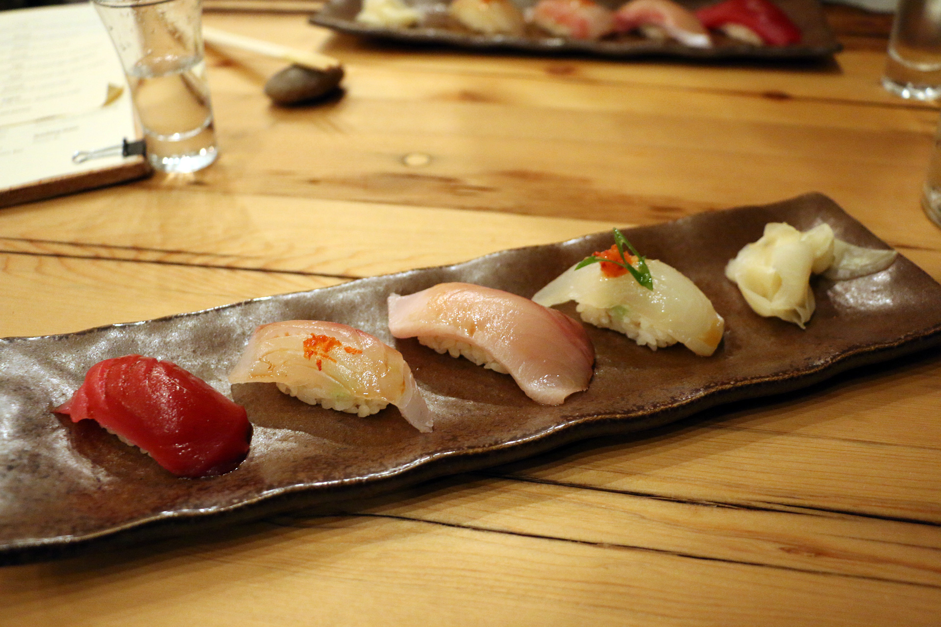 Four pieces of nigiri, the first of two rounds.