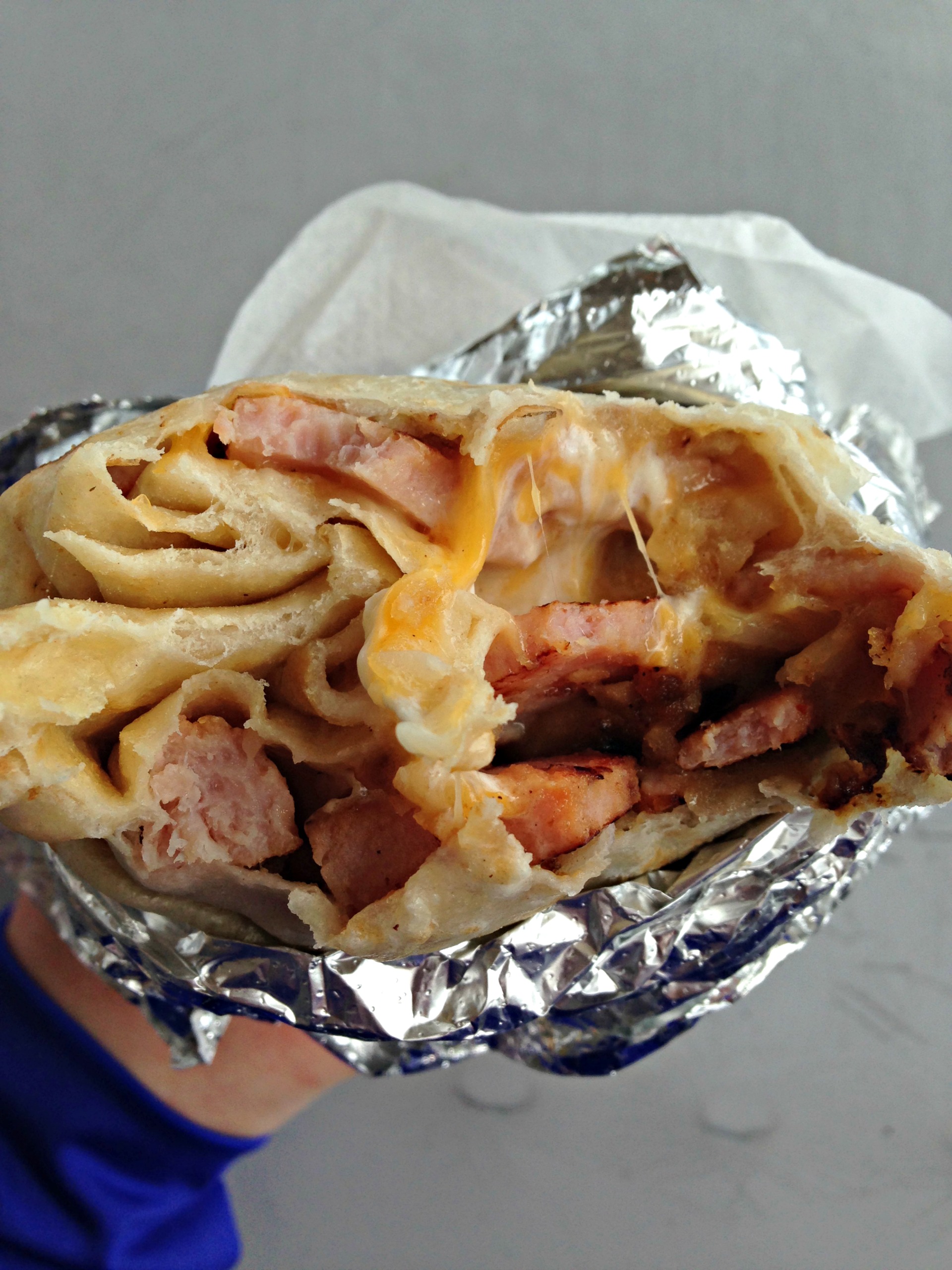 A suprisingly delicious ham breakfast burrito from Kelly's Deli in Emeryville.