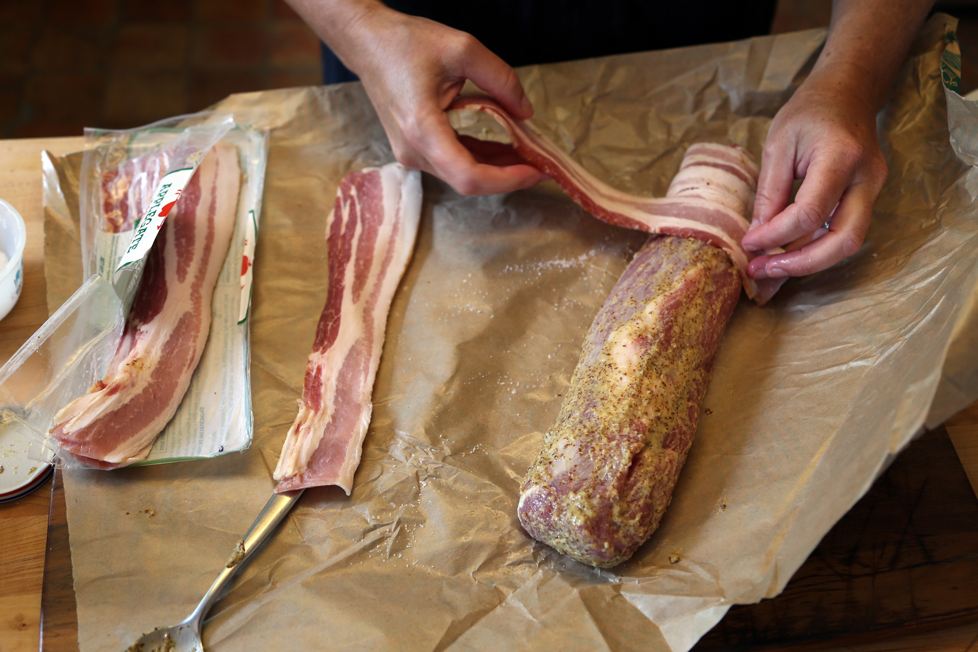 Wrap the bacon around the tenderloin.
