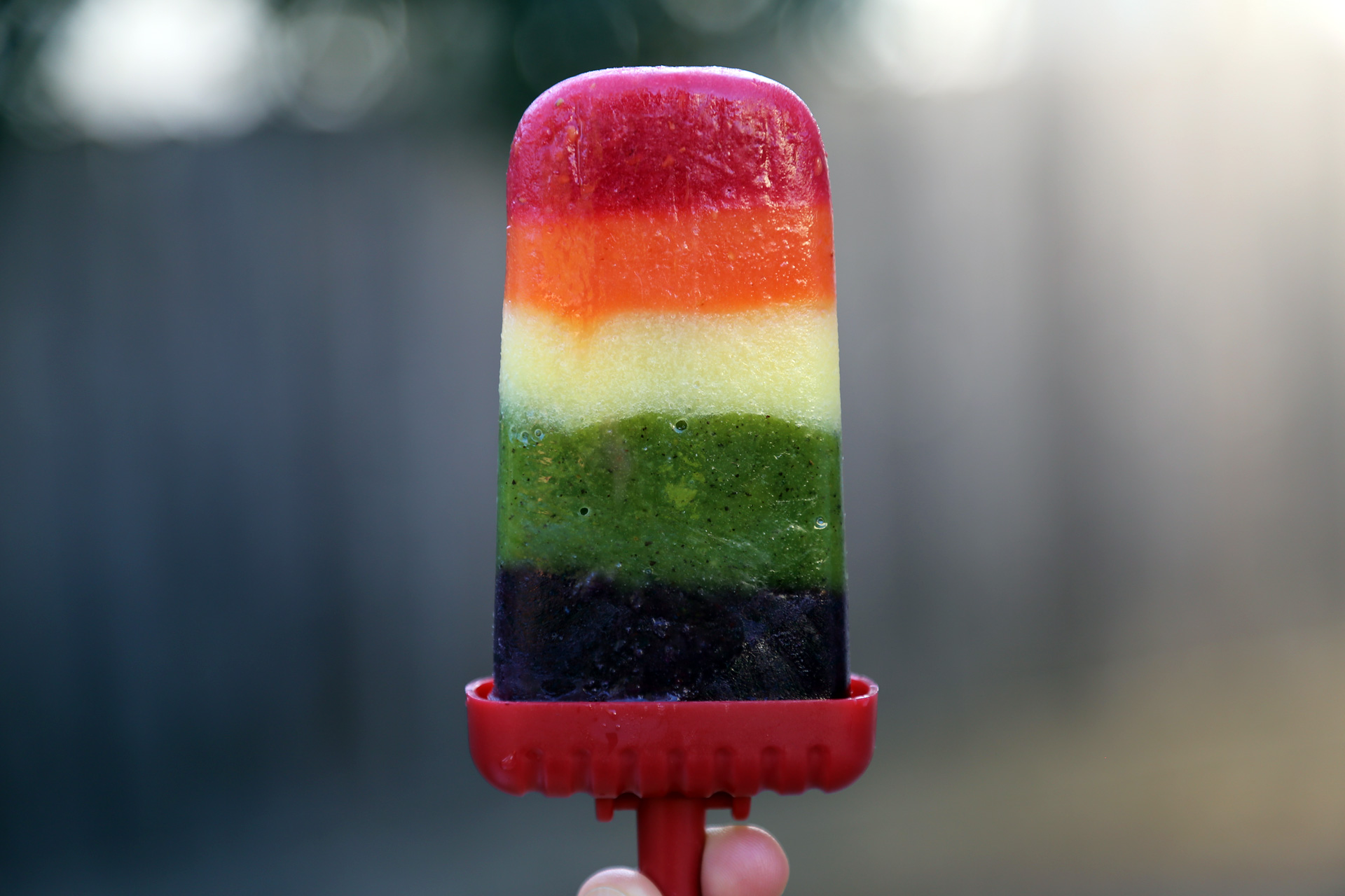 Serve the Fresh Fruity Rainbow Popsicles for Pride or your next summer barbecue