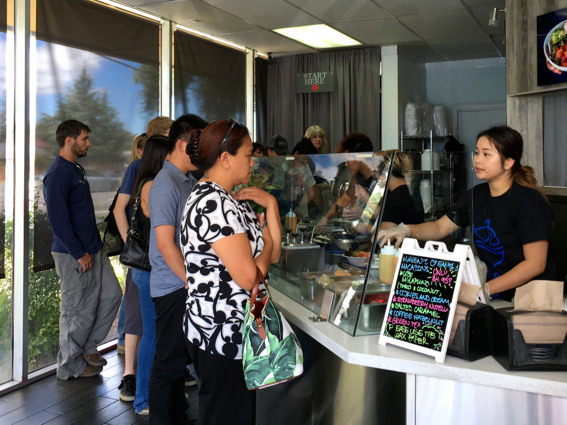 Customers in line at Poki Bowl in San Jose.