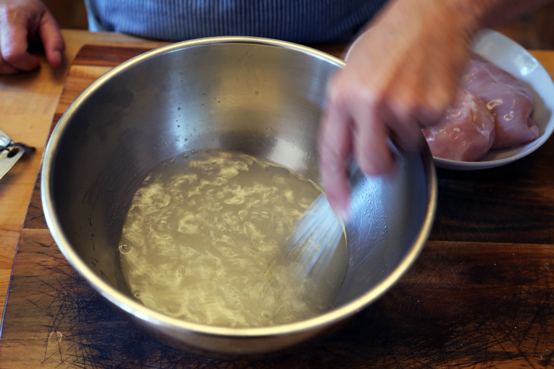 In a bowl, stir together 1 cup hot water with the salt and sugar, until dissolved. Add 3 cups very cold water and stir until combined.