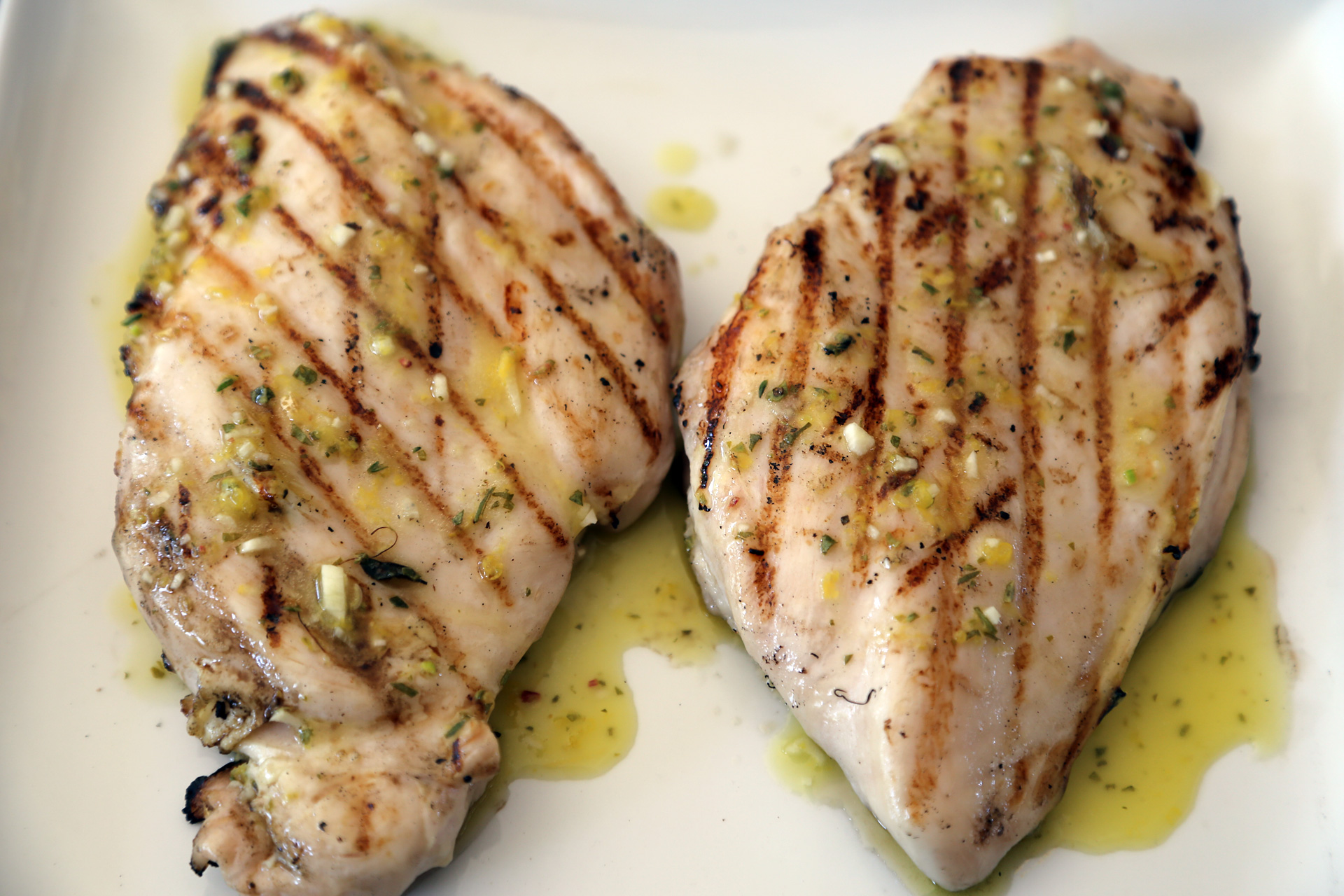 Spoon the vinaigrette on top of the rested chicken breasts and serve.