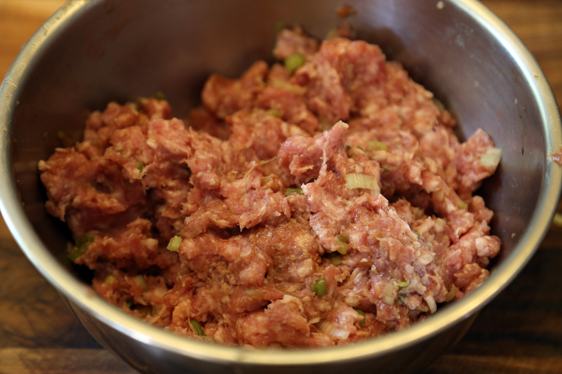 Add the pork and gently mix with your hands to combine.