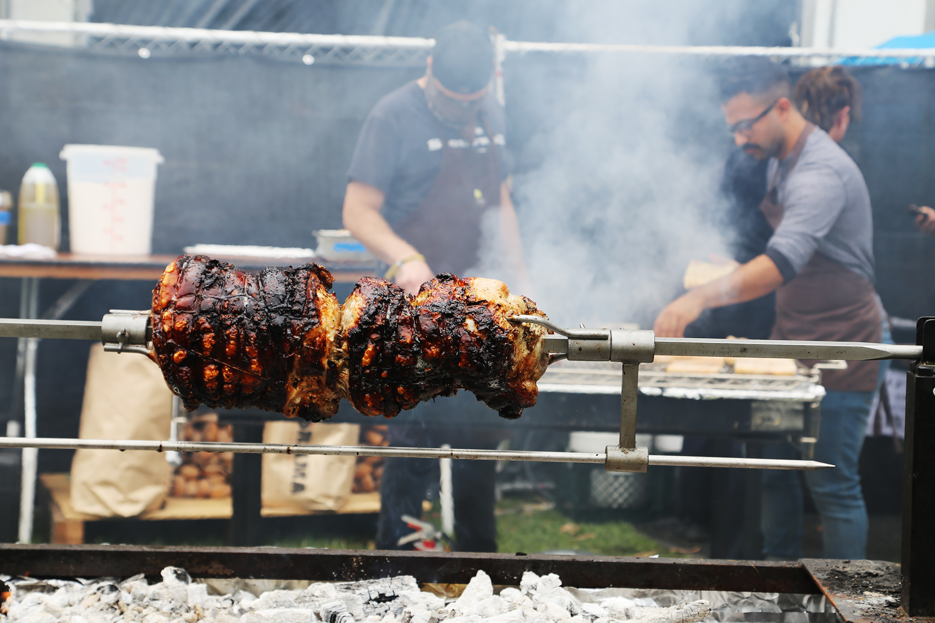 Grilling the Puerto Rican Pork on the rotisserie at Split Pea Seduction