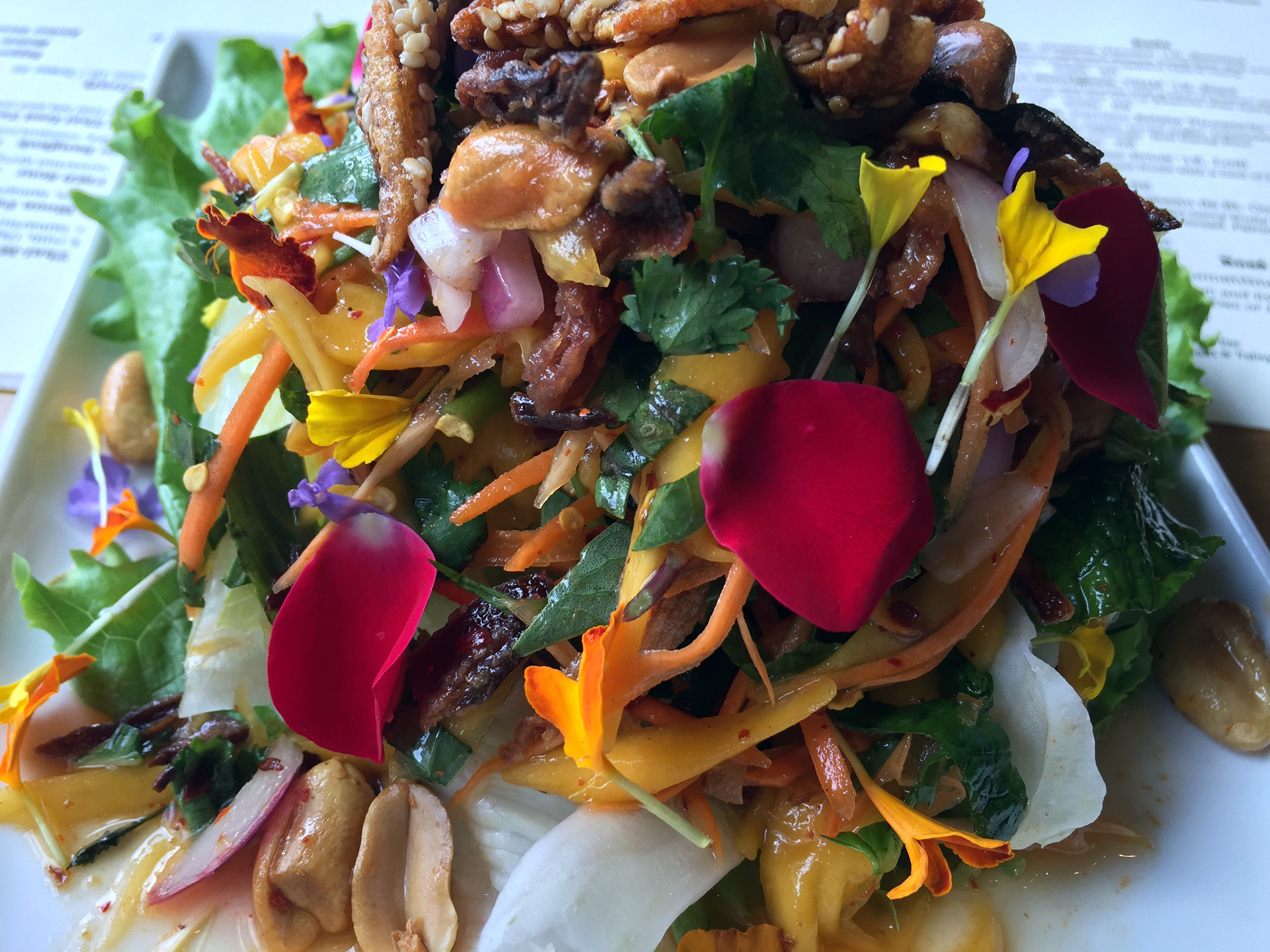 Mango salad with sesame-crusted anchovies.