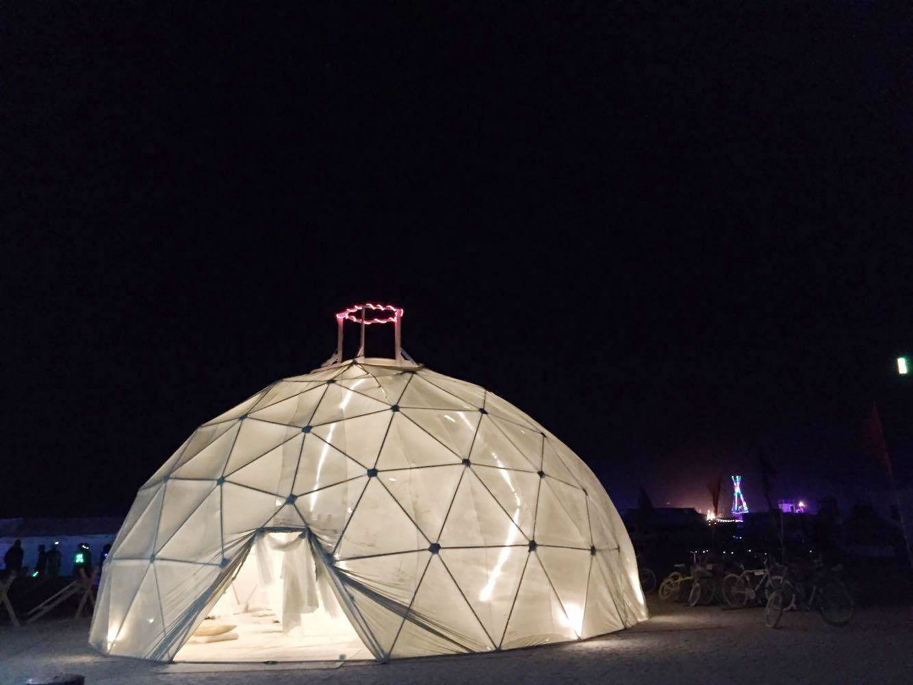Milk and Honey’s geodesic dome at night.