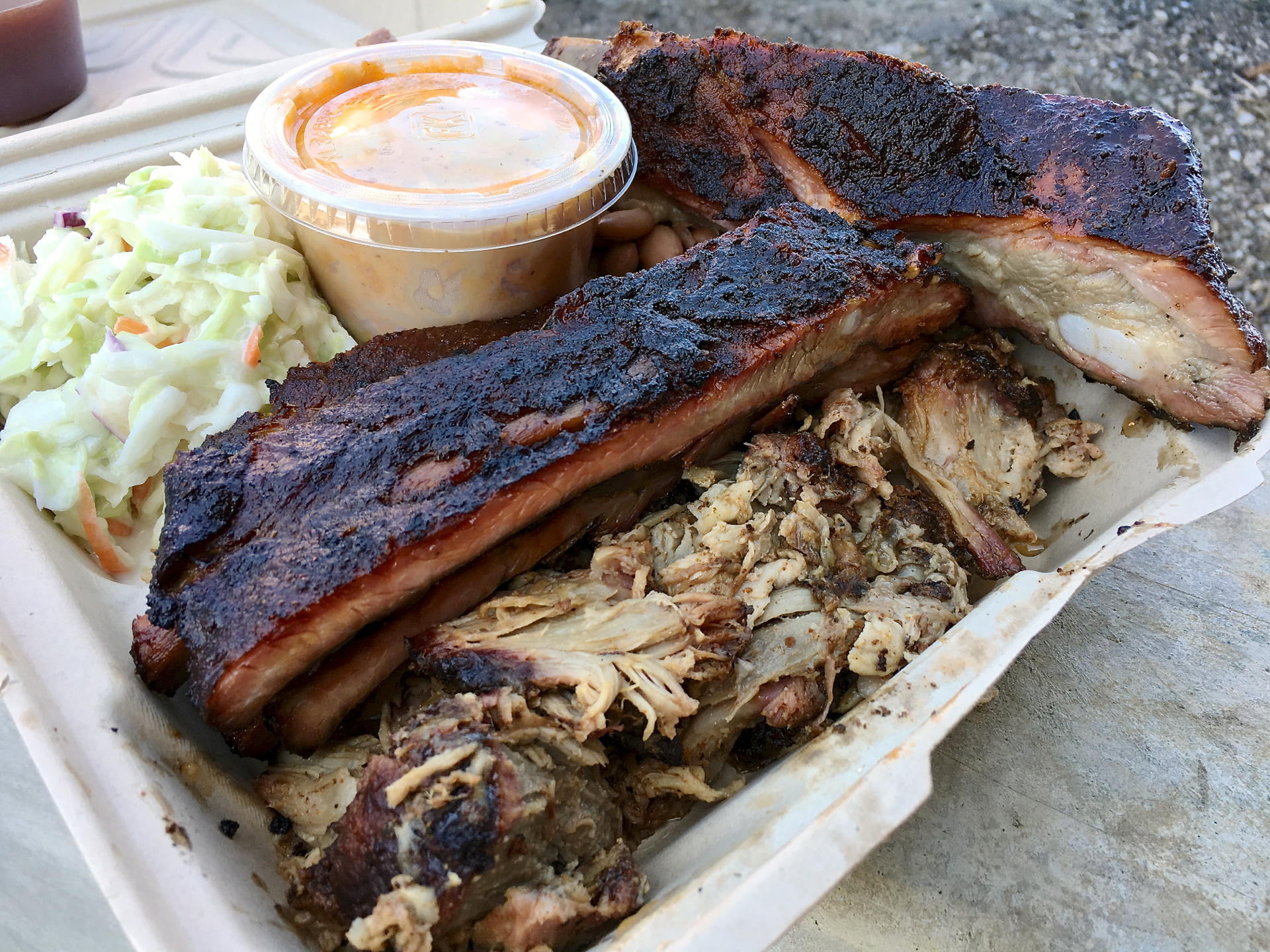 A combination plate with ribs and pulled pork at Gorilla BBQ.