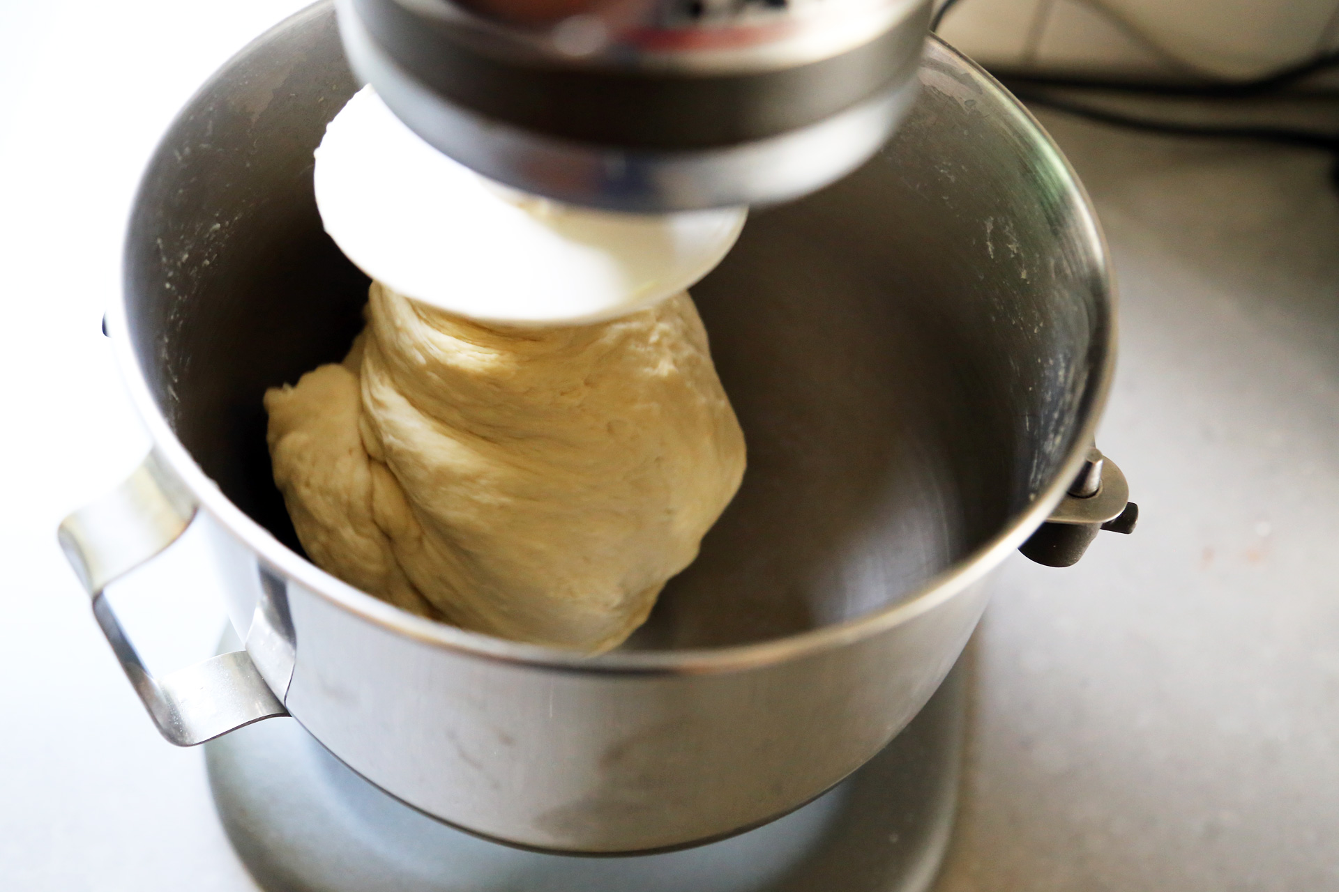 Increase the speed to medium and knead for 8 to 10 minutes, until the dough softens and looks smooth and soft.