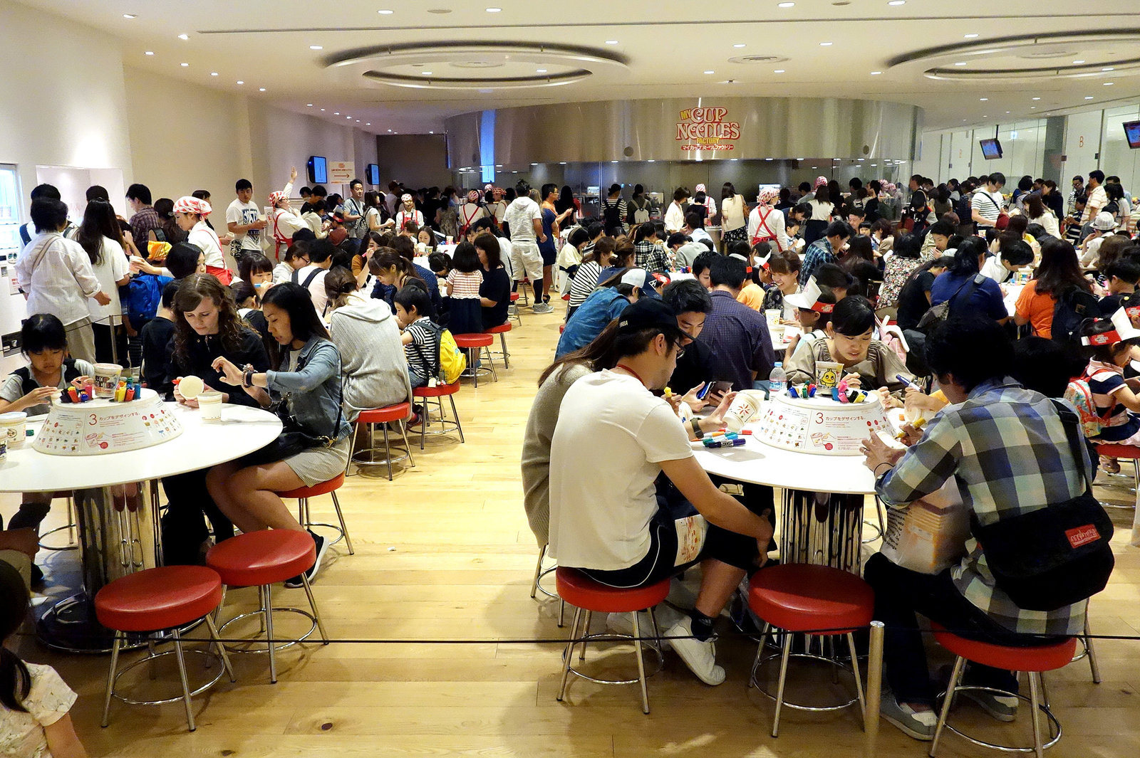 Crowds fill the Cup Noodles Museum in Yokohama, Japan, to decorate their own branded cups before creating personal noodle flavor blends.