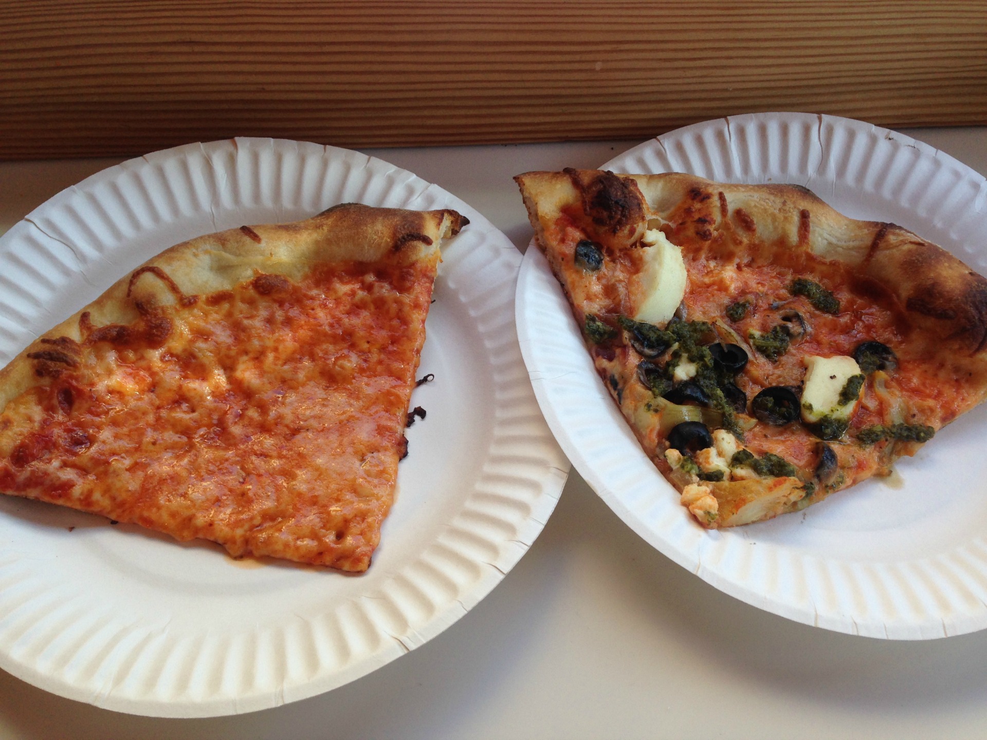 A slice of cheese and a slice of artichoke pesto from Berkeley's Pizzahhh.