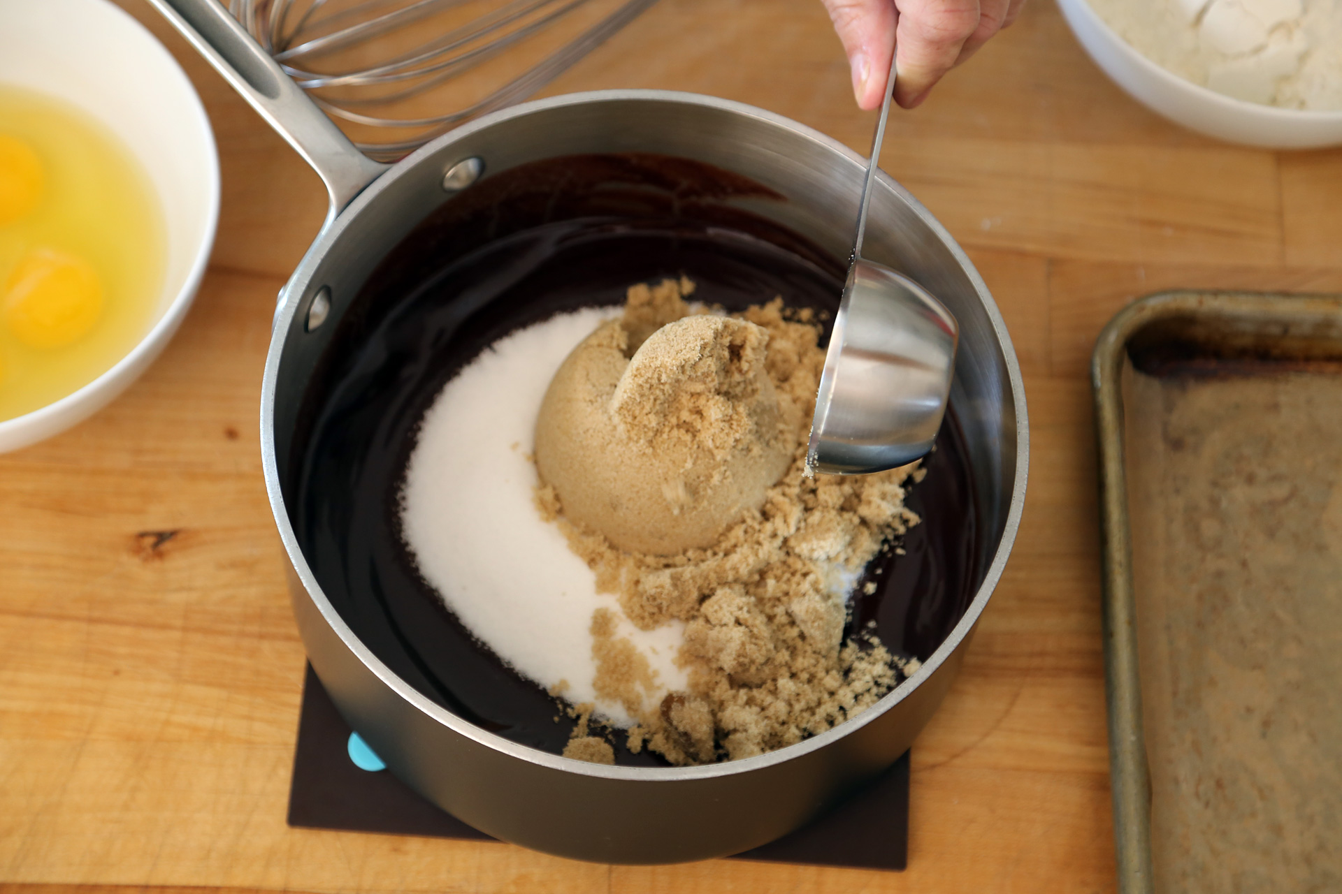 Remove from the heat and stir in the sugars with a whisk.