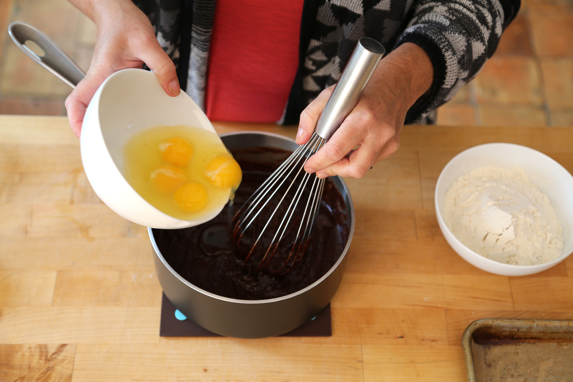 Add the eggs one at a time, whisking well after each addition.