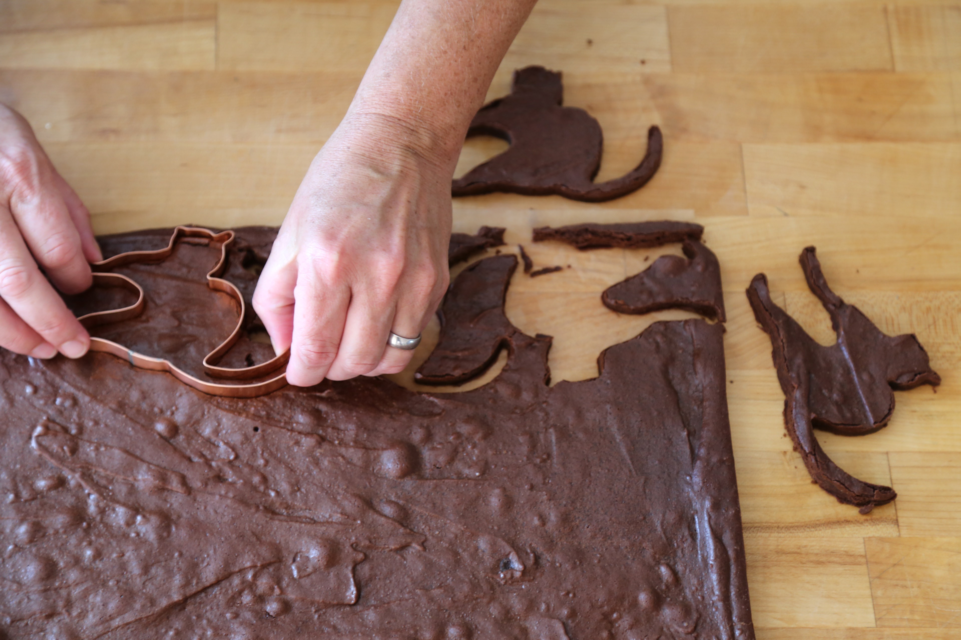 Using your favorite shaped cookie cutter, cut out as many brownie cookies as possible.