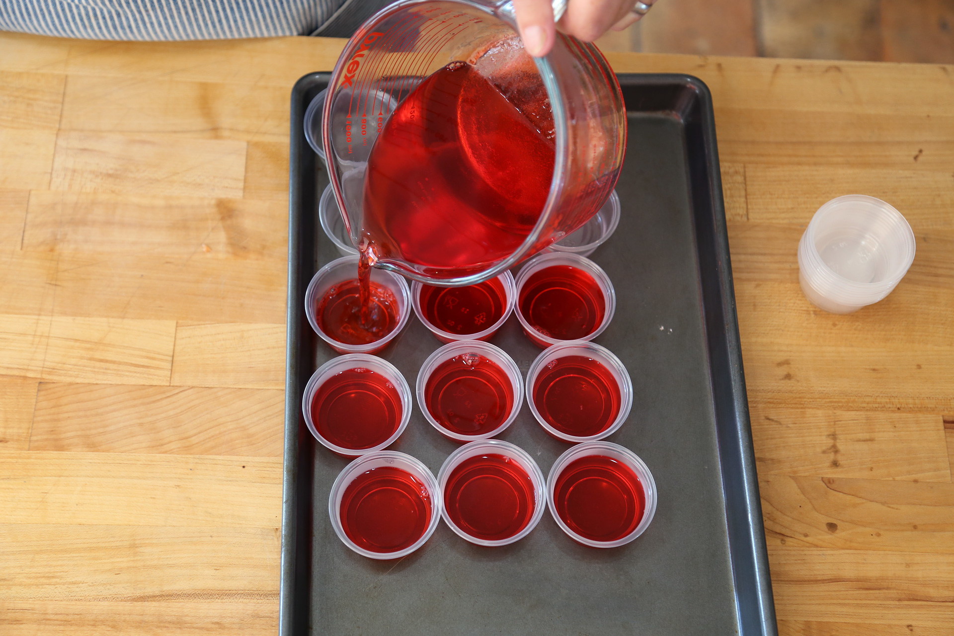 Divide between the plastic cups, filling them 3/4 full. Place on a baking sheet and refrigerate until firm, about 1 hour.