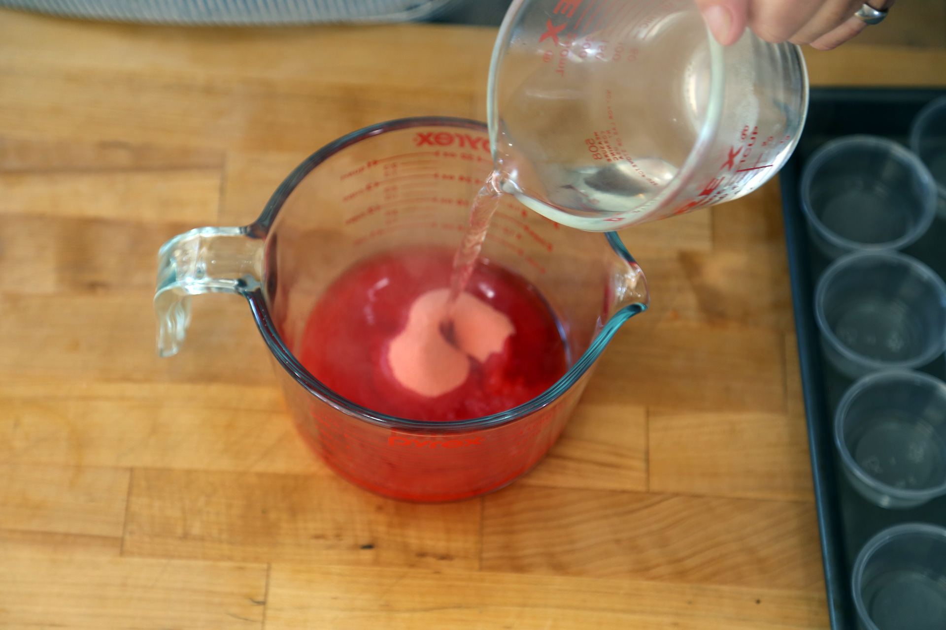In a medium bowl add the gelatin and boiling water, stir to combine, then stir in the vodka mixture. 