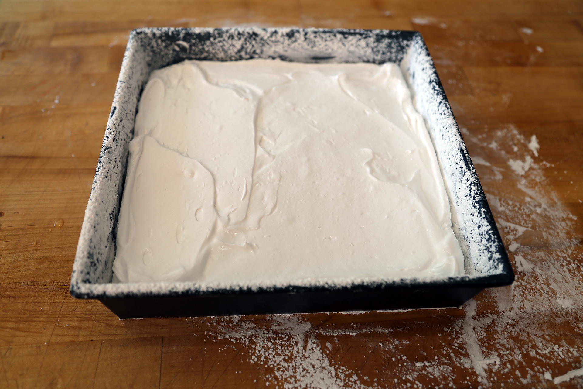 Let stand until a skin forms on the surface, about 1 hour, then dust with some of the reserved powdered sugar mixture. Let sit in a cool place until firm, about 2 hours or overnight.
