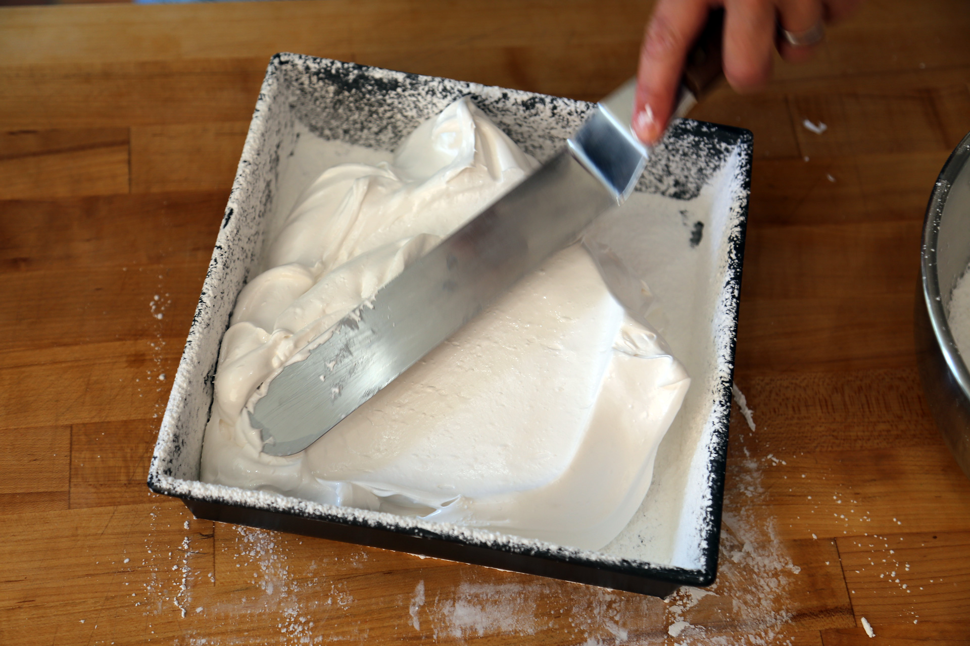 Then, using a lightly oiled offset metal spatula, spread the mixture into an even layer.