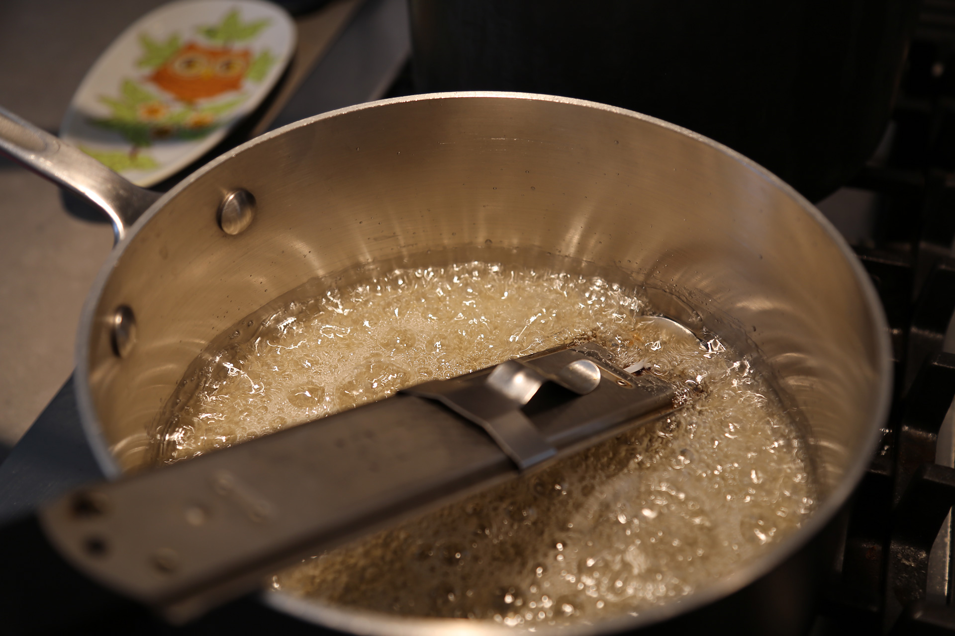 Bring to a boil over high heat, swirling the pan occasionally but not stirring, until the mixture reads 245°F on a candy thermometer. 