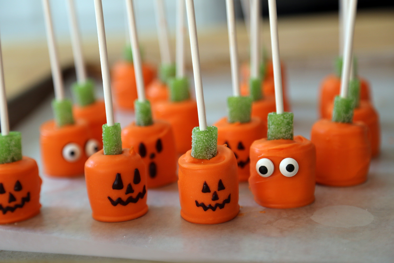 Alternatively, put a blob of chocolate on the pumpkins and add candy eyeballs.