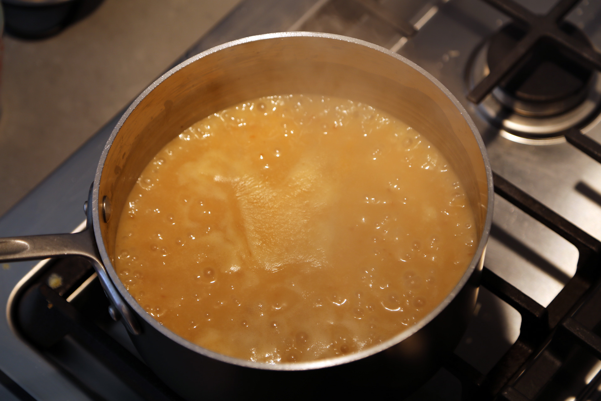 Bring to a boil, reduce the heat slightly, and let simmer for a few minutes to thicken slightly.
