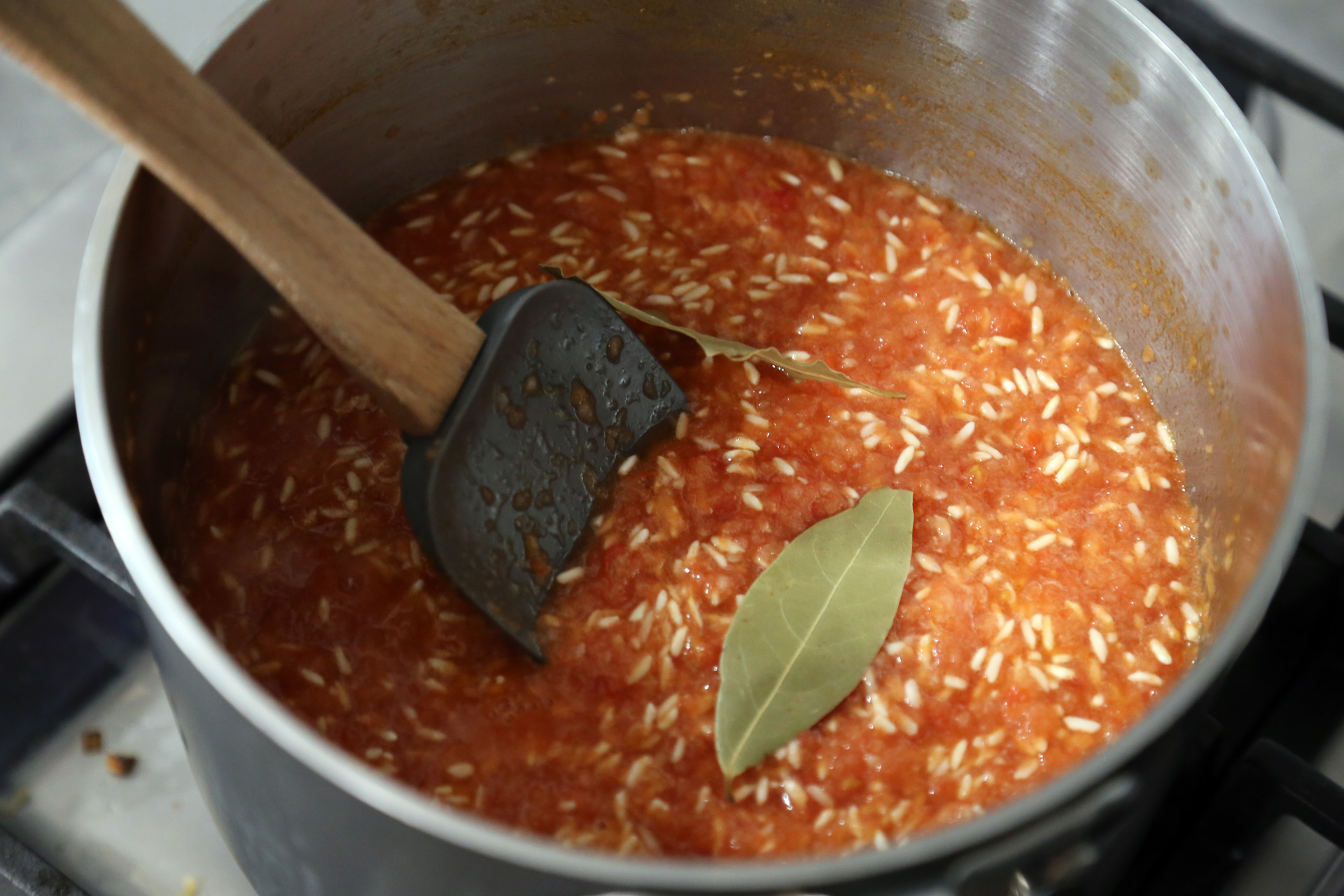 Add the salt and bay leaves and stir to combine. Bring to a boil, cover, and reduce the heat to low. Let simmer, covered, for 20 minutes. Turn off the heat and leave the rice to steam for 10 minutes without lifting the lid.