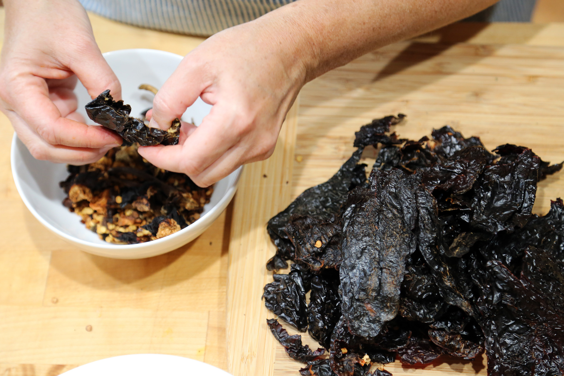 Dried chiles, such as ancho, pasilla or other mildly spicy chile, trimmed, seeded, and torn into pieces.