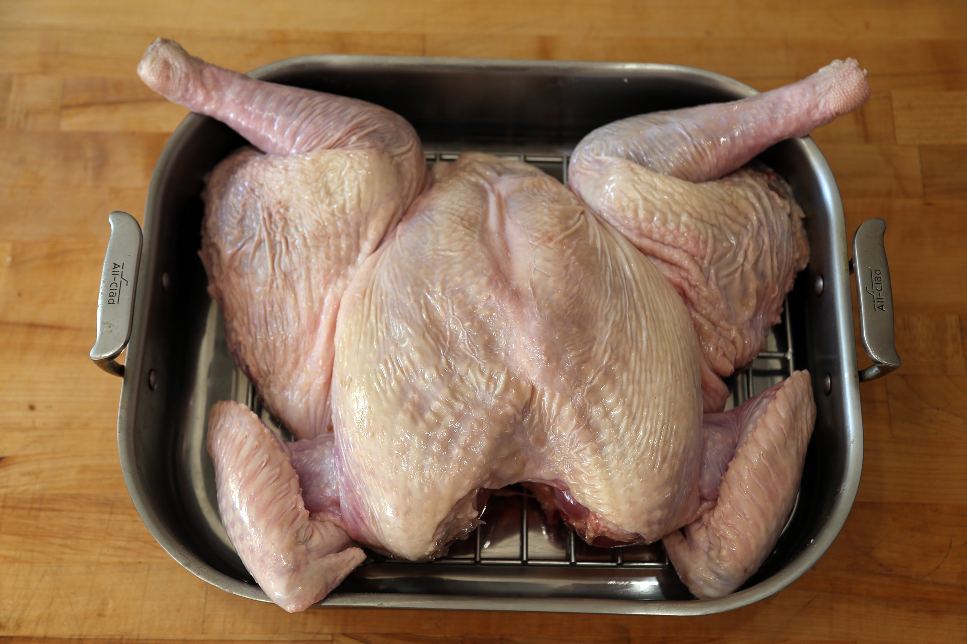 Place the turkey breast-side-up on a rack large enough to hold the bird – it can be a rack that fits into a large roasting pan or over a cooling rack that will fit over a rimmed baking sheet.